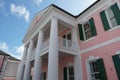 Part of pink building of Parliament House in Colonial architect style in Parliament Square situated in downtown Nassau.