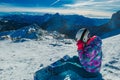 Nassfeld - A snowboarder taking a break on the slope