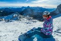 Nassfeld - A snowboarder taking a break on the slope