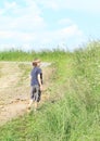 Nasty boy walking in mud Royalty Free Stock Photo