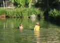 Nasty kids in clothes soaking wet in water