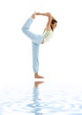 Natarajasana lord of the dance pose on white sand Royalty Free Stock Photo