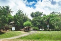 Natine rural houses on Beautiful vibrant background consisting of trees of the rain forest of Central America. Typical Royalty Free Stock Photo