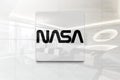 Nasa on glossy office wall realistic texture Royalty Free Stock Photo