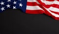 National American silk fabric flag on black background, flat lay Royalty Free Stock Photo