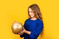 National colors of Ukraine. Blue and yellow. Shimmering glitter. Prepare decorations in advance. Girl hold golden ball