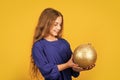 National colors of Ukraine. Blue and yellow. Shimmering glitter. Prepare decorations in advance. Girl hold golden ball