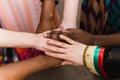 National diversity. People of different appearance and nationality stand in a circle together and hold hands. Team building and pa