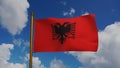 National flag of Albania waving 3D Render with flagpole and blue sky, Republic of Albania flag textile, Flamuri Kombetar Royalty Free Stock Photo