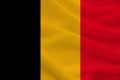 National flag of belgium on gentle silk with wind folds, travel concept, immigration, politics, copy space, close-up