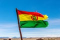 Bolivian Flag waving in the wind against blue sky background Royalty Free Stock Photo