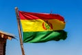 Bolivian Flag waving in the wind against blue sky background Royalty Free Stock Photo