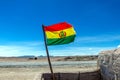 Bolivian Flag waving in the wind against blue sky background Royalty Free Stock Photo