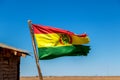 Bolivian Flag waving in the wind against blue sky background Royalty Free Stock Photo