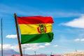 Bolivian Flag waving in the wind against blue sky background Royalty Free Stock Photo