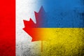 National flag of Canada with National flag of Ukraine. Grunge background