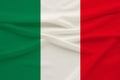 The national flag of the country of Italy on gentle silk with wind folds, travel concept, immigration, politics, copy space, close Royalty Free Stock Photo