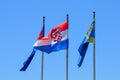 National flag of Croatia and region of Dalmatia on poles in Makarska, Croatia on June 21, 2019.