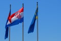 National flag of Croatia and region of Dalmatia on poles in Makarska, Croatia on June 21, 2019.