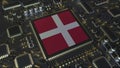 National flag of Denmark on the operating chipset. Danish information technology or hardware development related