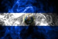 National flag of El Salvador made from colored smoke isolated on black background. Abstract silky wave background.