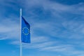 National flag of the European Union EU against the clear blue sky, blown by the wind Royalty Free Stock Photo