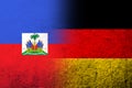 The national flag of Germany with Haiti National flag. Grunge background Royalty Free Stock Photo