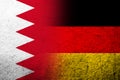 The national flag of Germany with The Kingdom of Bahrain national flag. Grunge background