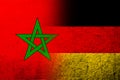 The national flag of Germany with The Kingdom of Morocco National flag. Grunge background Royalty Free Stock Photo