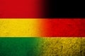 The national flag of Germany with Plurinational State of Bolivia National flag. Grunge background