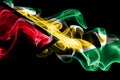 National flag of Guyana made from colored smoke isolated on black background. Abstract silky wave background Royalty Free Stock Photo