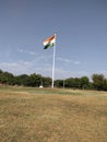 The national flag of India, also known as the tricolor, is a flag embellished by a circle of blue between three horizontal stripes
