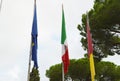 The national flag of Italy, the European Union EU flag of the city of Rome on the flagpole near the city Hall of Rome Royalty Free Stock Photo