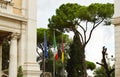 The national flag of Italy, the European Union EU flag of the city of Rome on the flagpole near the city Hall of Rome Royalty Free Stock Photo