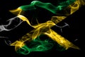 National flag of Jamaica made from colored smoke isolated on black background. Abstract silky wave background.