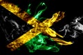 National flag of Jamaica made from colored smoke isolated on black background. Abstract silky wave background. Royalty Free Stock Photo