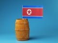 A national flag of North Korea on wooden stick in wooden barrel