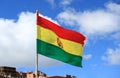 National Flag of the Plurinational State of Bolivia Waving on Sunny Blue Sky, Bolivia