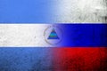 National flag of Russian Federation with The Republic of Nicaragua National flag. Grunge background