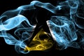 National flag of Saint Lucia made from colored smoke isolated on black background. Abstract silky wave background. Royalty Free Stock Photo