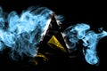 National flag of Saint Lucia made from colored smoke isolated on black background. Abstract silky wave background. Royalty Free Stock Photo