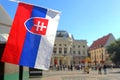 National flag of Slovakia and view of Slovak National Theatre on Hviezdoslavovo square, Bratislava Royalty Free Stock Photo