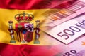 National flag of spain and euro banknote - concept. Euro coins. Euro money. Euro currency