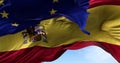 The national flag of Spain waving in the wind together with the European Union flag blurred in the foreground Royalty Free Stock Photo