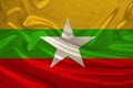 National flag of the state of Myanmar on beautiful silk, the concept of tourism, emigration, economy, politics, civil rights and