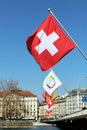 Swiss flag on Mont-Blanc bridge in Geneva, Switzerland. Royalty Free Stock Photo