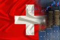 national flag of switzerland on silk, barrels of oil, metal coins, oil futures trading concept, growth of DBO index on stock Royalty Free Stock Photo