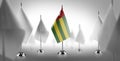 The national flag of the Togo surrounded by white flags