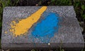 National flag of ukraine depicting in paint colors on an old brick. flag banner on brick Royalty Free Stock Photo