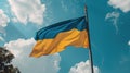 National flag of Ukraine on pole against blue cloudy sky, Ukrainian symbol Royalty Free Stock Photo